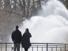 Andrew Bisback and Mary Wolsley admire the Walter J. Blackburn Memorial Fountain at the Forks of the Thames River  in London, Ont. on Sunday March 25, 2018. (Derek Ruttan/The London Free Press)