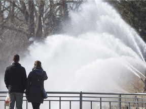 Andrew Bisback and Mary Wolsley admire the Walter J. Blackburn Memorial Fountain at the Forks of the Thames River  in London, Ont. on Sunday March 25, 2018. (Derek Ruttan/The London Free Press)