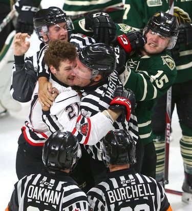 Cole Tymkin of the Knights gets a double roughing penalty in a scrum with Owen Sound's Jonah Gadjovich who got a cross check minor during the first period of their playoff game on Monday March 26, 2018 at Budweiser Gardens.  Mike Hensen/The London Free Press/Postmedia Network