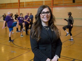 Clara Fitzgerald, director of Western University's Canadian Centre for Activity and Aging in the new home of the Canadian Fitness Institute at 1490 Richmond St. in London. Behind her, Debbie DeVries is leading a regular CCAA fitness class. (DEREK RUTTAN, The London Free Press)