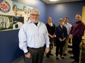 Global Dispatch Solutions CEO Anthony Royer with employees of Dominion Automobile Association, Lieete Gerth, Holl Macgowan, Wayne Abadie and Steve Jones in London. (DEREK RUTTAN, The London Free Press)