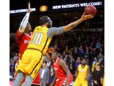 London Lightning forward Royce White tries a finger roll against Windsor's Damontre Harris but couldn't get it to fall during the first quarter of their Wednesday night game at Budweiser Gardens in London, Ont.  Photograph taken on Wednesday March 28, 2018.  Mike Hensen/The London Free Press/Postmedia Network