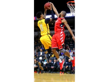 Mo Bolden of the London Lightning gets stuffed by Sefton Barrett of the Windsor Express during the first half of their Wednesday night game at Budweiser Gardens in London, Ont.  Photograph taken on Wednesday March 28, 2018.  Mike Hensen/The London Free Press/Postmedia Network