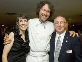 Lindey and David McIntyre embrace chef Michael Smith, the star of the McIntyre's Cook the Book fundraiser for Bethany's Hope in this file photo. (Free Press files)