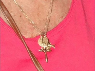 Strangers took this necklace, with charms, from Nancy Chwiecko, 84, in a parking lot outside the hair salon in London Tuesday, March 20.