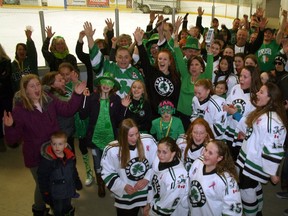 The Lucan community joined together at the Lucan Community Memorial Centre on March 17 to hear the news about the town cracking Kraft Hockeyville's top four. Pictured are members of the Lucan community with Mayor Cathy Burghardt-Jesson and some of the Lucan Irish Bantam C team cheering the news by the Lucan ice.