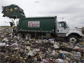 A city garbage truck unloads of garbage at the city landfill on Manning Drive. (Free Press file photo)