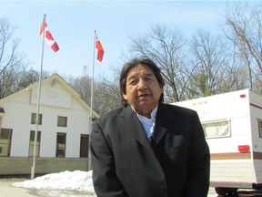 Maynard T. George stands outside a trailer parked at the entrance of Pinery Provincial Park on Tuesday, March 20.  He and other members of his family say the park is part of a large tract of land owned by their ancestors that was never properly surrendered. 
Paul Morden/Postmedia Network