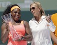 In this April 4, 2015, file photo, former tennis star Martina Navratilova, right, poses with Serena Williams, after Williams won the women's final match at the Miami Open. Navratilova says she is "angry" and feels let down by the BBC after learning that John McEnroe gets paid at least 10 times more than her for their broadcasting roles at Wimbledon.(Alan Diaz/AP Photo)