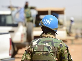 A Bangladeshi United Nations soldier walks by a car during the weekly cattle market in Gao, Mali, in this file shot from 2017.