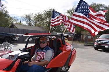 Ex military man Don Edwards displays his patriotism proudly aboard his slingshot (a three-wheel motorcycle) on Veterans Day in Amarillo, Texas.

BARBARA TAYLOR/The London Free Press/Postmedia NewsAmarillo Veterans Day Parade