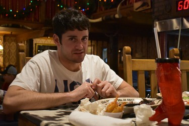 Ross Kahn of Dallas pauses during his valiant effort to eat a 72-ounce steak and "fixins" at Amarillo's Big Texan Steak Ranch & Microbrewery. The famous Texas eatery provides the big meal free if the diner can down it within an hour. Ross called it quits with nine minutes left on the clock, leaving about 25 per cent of the steak on his plate. Failing to complete meal, meant Kahn had to pay $72.

BARBARA TAYLOR/The London Free Press/Postmedia News
