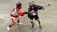 Isaac Doxtator with the Point Edward Jr. B Pacers guards against Quincy Abram of the London Blue Devils during an exhibition lacrosse game in April at the Point Edward Arena. (Handout, Point Edward Pacers)