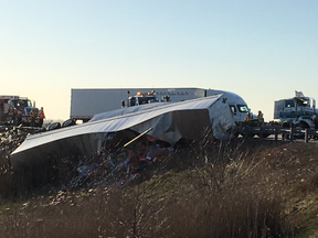 Westbound traffic on Hwy. 401 was snarled Monday morning after a tractor trailer rolled near an off ramp at Highbury Avenue. Jennifer Bieman/The London Free Press