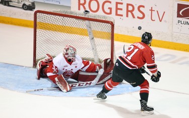 Jonah Gadjovich backhands a shot wide on the breakaway as Greyhounds' goalie Matthew Villalta spreads out in the crease during the first period of Game 6 between the Owen Sound Attack and Sault Ste. Marie Greyhounds at the Harry Lumley Bayshore Community Centre on Sunday. Greg Cowan/The Sun Times