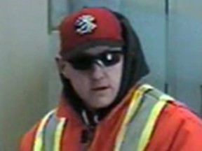 A man believed to be in his 30s, shown in this photo released by London police, is being sought in a bank robbery Monday at the CIBC branch near Hyde Park Road and Oxford Street.