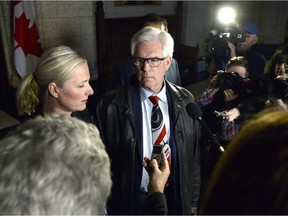Minister of Natural Resources Jim Carr looks towards Minister of Environment and Climate Change Catherine McKenna as they make remarks to reporters after an emergency cabinet meeting on Parliament Hill in Ottawa on Tuesday, April 10, 2018.