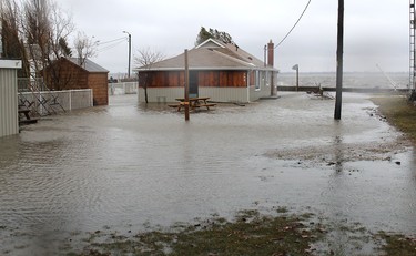 Strong winds caused large waves from Rondeau Bay to flood several areas in Erieau on Sunday. Ellwood Shreve/Chatham Daily News/Postmedia Network