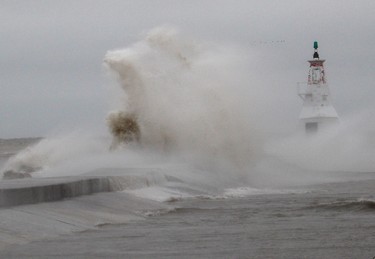 Waves on Lake Erie crash over the pier in Erieau on Sunday. Ellwood Shreve/Chatham Daily News/Postmedia Network