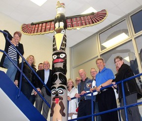 These Tecumseh Secondary School grads are among those who support keeping the totem pole, created by four students in the early 1970s, a part of the Chatham school. Photo taken in Chatham, Ont. on Monday April 16, 2018. (Ellwood Shreve/Postmedia Network)
