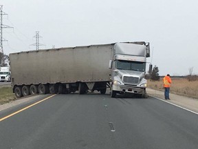 Chatham-Kent OPP investigate after a double crossover collision on Highway 401 near Charing Cross Road on Tuesday afternoon. No one was injured, but an advocate for concrete median barriers says it could have been a fatality. (Handout)