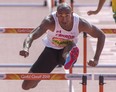 Canada's Damian Warner competes in the 110m hurdles event in the men's decathlon at the Commonwealth Games Tuesday. (THE CANADIAN PRESS)