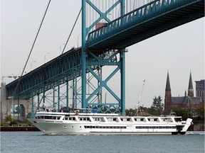 In this Aug. 19, 2014, file photo, the Grande Carib cruise ship sails under the Ambassador Bridge as it makes it's way along the Detroit River.