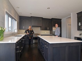 Happy homeowners in their Dynamic Kitchens space