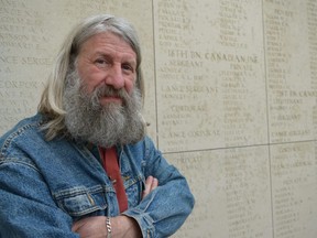 Retired Belgian army officer Erwin Ureel, familiar with every major engagement in Belgium by Canada in both world wars, pauses by Canadian names inscribed on the Menin Gate. The monument in Ypres, Belgium, commemorates 55,000 First World War dead, including almost 7,000 Canadians, with no known graves. (JENNIFER BIEMAN, The London Free Press)