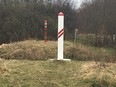 A simple red and white marker on the Latvian side and a green and red marker on the Russian side are the only signs to demarcate the Latvian-Russia border. Postmedia file photo