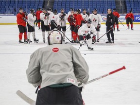 Canada's Jonah Gadjovich approaches the net against goalie Carter Hart during team practice at the IIHF World Junior Hockey Championship in Buffalo, N.Y., Monday, January 1, 2018.