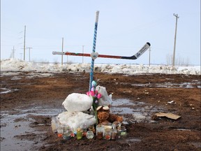 A cross made from hockey sticks is shown on April 9, 2018. It marks the place where 15 died in the Humboldt Broncos bus crash on April 6.
