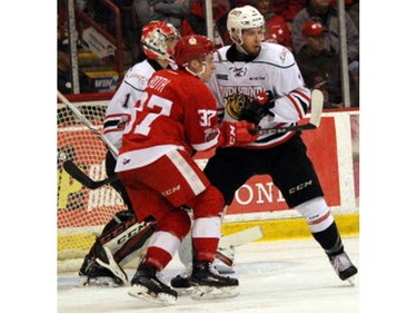 Sault Ste. Marie Greyhounds winger Ryan Roth (37) and Owen Sound Attack defenceman Cole Cameron mix it up in front of Attack goaltender Mack Guzda during Game 7 of their OHL Western Conference semifinal Tuesday at Essar Centre in Sault Ste. Marie. The Greyhounds won 9-7 to clinch the series. JEFFREY OUGLER/SAULT STAR