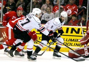 Owen Sound Attack Ethan Szypula and Nick Suzuki pressure Soo Greyhounds goalie Matthew Villalta during first-period action of game five of the OHL Western Conference semi-final series at Essar Centre in Sault Ste. Marie on Friday. (BRIAN KELLY/POSTMEDIA NETWORK)