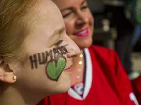 Olivia Cheeseman, 11 has Humbolt Strong written on her face. She was with her mom Stefanie and brother Mason,7, at the jersey ceremony at Covent Garden Market on Thursday. (Mike Hensen/The London Free Press)