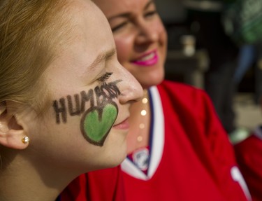 Olivia Cheeseman, 11, has Humbolt Strong written on her face. She was with her mom Stefanie and brother Mason,7, at a ceremony at Covent Garden Market on Thursday. Photo taken April 12, 2018. (Mike Hensen/The London Free Press)