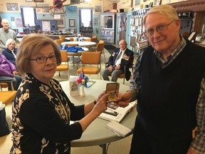 Betty Murray, cousin of  Frederick Granger who served in the RCAF and died during the Second World  War present his Memorial Cross to Terry Rushton of  the 427 Wing  Museum. Hank Daniszewski/London Free  Press