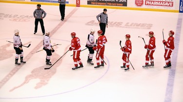 Owen Sound Attack captain Jacob Friend leads his team through the handshake line after the Sault Ste. Marie Greyhounds' 9-7 victory in Game 7 of the Western Conference semifinal. (Greg Cowan/The Sun Times)