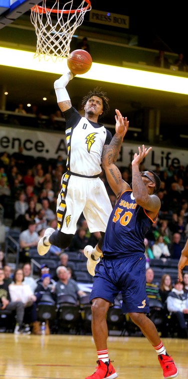 Mo Bolden of the London Lightning misses a dunk as he's guarded by Carl Hall of the Island Storm.
Mike Hensen/The London Free Press