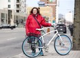 Shelley Carr would like the city to install protective bike lanes beginning with Dundas St. in London. (DEREK RUTTAN, The London Free Press)