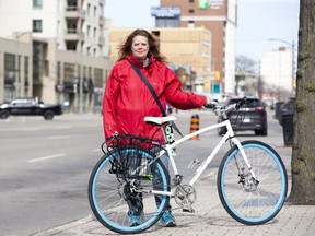 Shelley Carr would like the city to install protective bike lanes beginning with Dundas St. in London. (DEREK RUTTAN, The London Free Press)