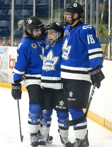 Max Vinogradov (middle) celebrates his first period goal against the St. Thomas Stars with London Nationals teammates Derek Di Iorio (left) and Josh Coyle at the Timken Centre in St. Thomas. (DEREK RUTTAN, The London Free Press)