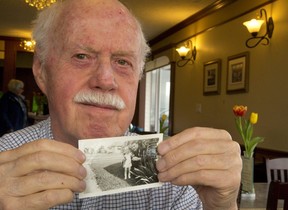 Jim Thorne of Manitoulin Island holds a photo of himself as a 14-month old toddler with his uncle Fred Larsen Kristensen who was on furlough in 1944 at a home on Sterling Street in London. (MIKE HENSEN, The London Free Press)