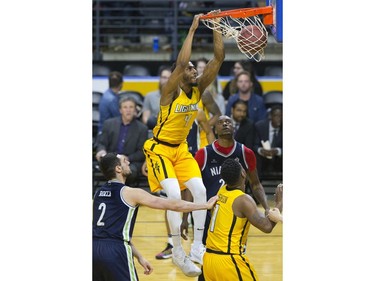 The London Lightning's Marcus Capers dunks during a 151-115 win over the Niagara River Lions in Game 1 of their best-of-five National Basketball League of Canada quarterfinal at Budweiser Gardens Friday. Derek Ruttan/The London Free Press