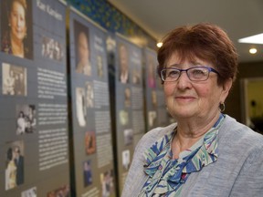 Anna Leich, of London, stands in front of a banner about her mom, Rae Kamien, at the Jewish Community Centre on Thursday.  The community centre is holding Yom Hashoah Commemoration tonight to remember the victims of the Holocaust and reflect on the losses. Leich was born and raised in a Soviet labour camp in what is now Kazakhstan. Her parents fled Poland in 1938 before the Nazis invaded in 1939 and worked there during the Second World War. Mike Hensen/The London Free Press