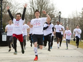 Actors Harry Judge and Wade Bogert-O'Brien lead the pack Friday as London's Grand Theatre promotes its upcoming production of Chariots of Fire in Victoria Park. The North American premiere of the play runs April 17 to May 5. (MIKE HENSEN, The London Free Press)