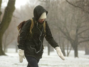 Apples Mastrogiacomo, 19, a Western student trudges through the rain/freezing rain Sunday morning in London. The wind and rain soaked pedestrians in no time, but the freezing rain seems to have passed. Mike Hensen/The London Free Press