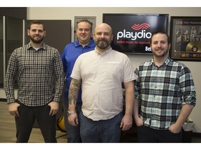 Playdio employees Cameron Gibson, left, president Dan Martens, Mat Lunnen and Derek Povey work for the London-based company that creates audio and video playlists for businesses. (Derek Ruttan/The London Free Press)