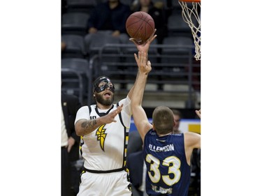 Royce White of the London Lightning shoots over Wally Ellenson of the St. John's Edge during Game 1 of their National Basketball League of Canada best-of-seven Central Division final Tuesday at Budweiser Gardens. Derek Ruttan/The London Free Press