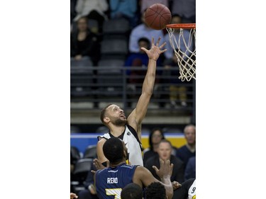 Garrett Williamson of the London Lightning shoots in front of Ryan Reid of the St. John's Edge during Game 1 of their National Basketball League of Canada best-of-seven Central Division final Tuesday at Budweiser Gardens. Derek Ruttan/The London Free Press